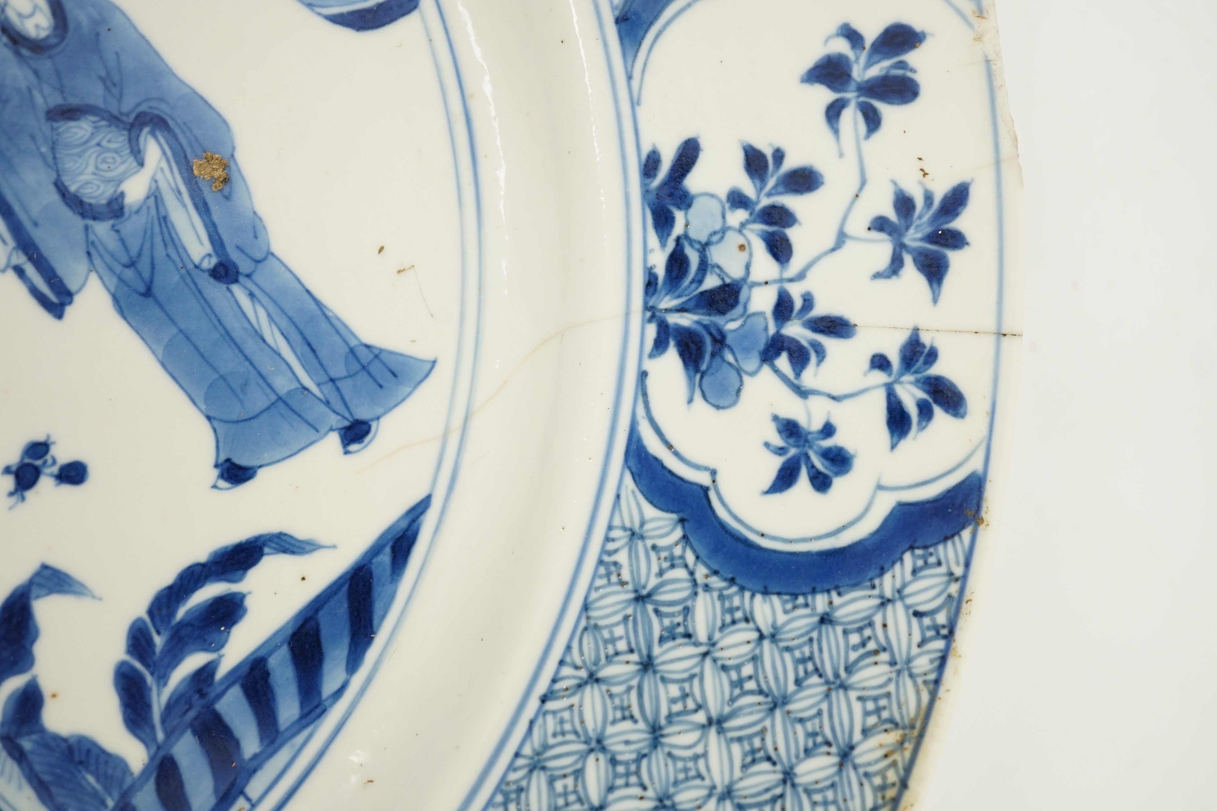 A Chinese blue and white ‘court scene’ dish, Kangxi period, two rim cracks and small splinter chips